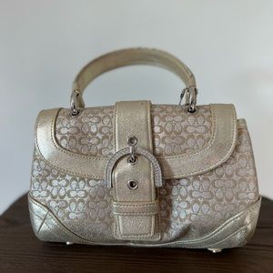 Silver/Gold Coach purse with rhinestone clasp